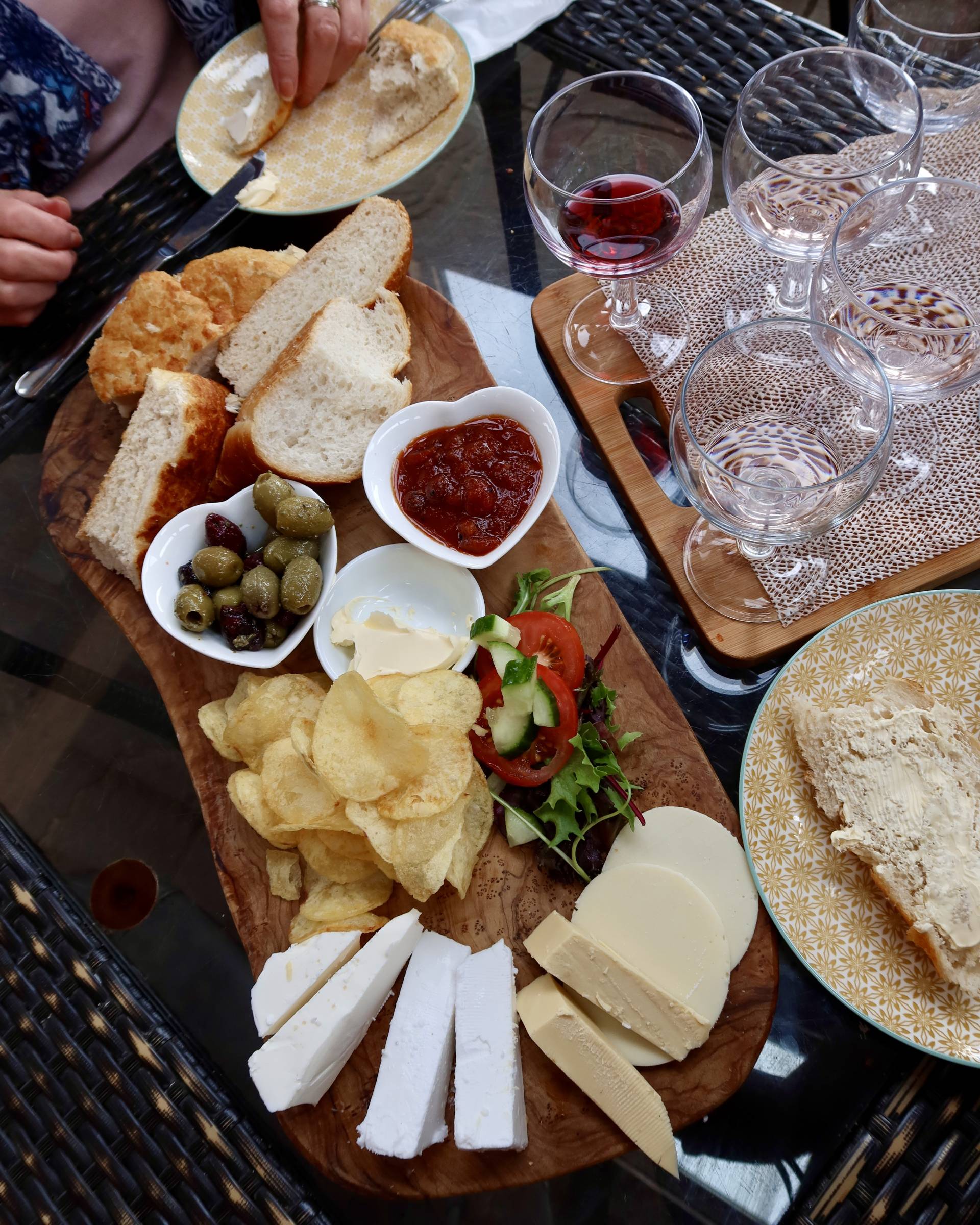Vegan Cheese platter at Sugar Loaf Vineyard in Wales with chutney and olives and bread
